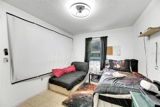 bedroom featuring light tile patterned floors and a textured ceiling