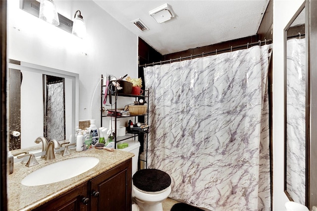 bathroom featuring a shower with curtain, a textured ceiling, toilet, vanity, and tile walls