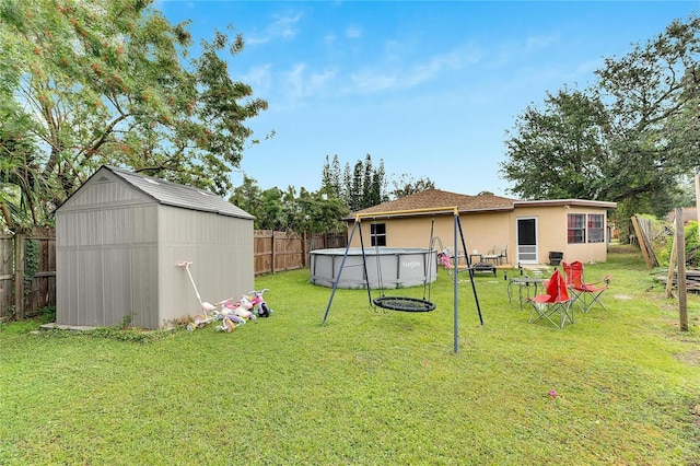 view of yard with a fenced in pool