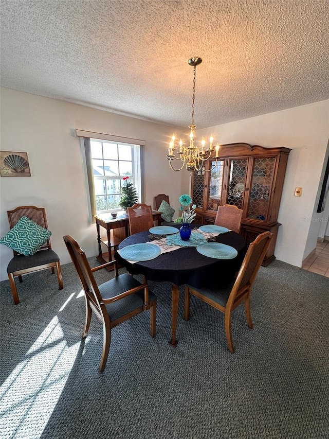 carpeted dining area with a textured ceiling and an inviting chandelier