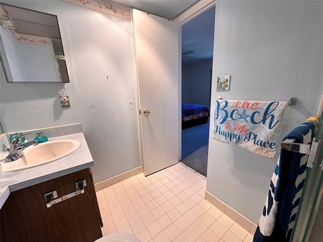 bathroom featuring tile patterned flooring and vanity