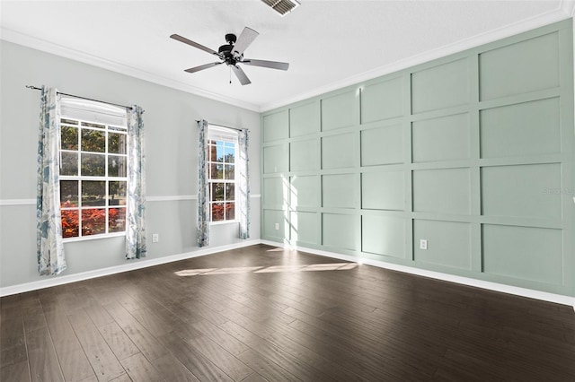 unfurnished room featuring ceiling fan, dark hardwood / wood-style flooring, and ornamental molding