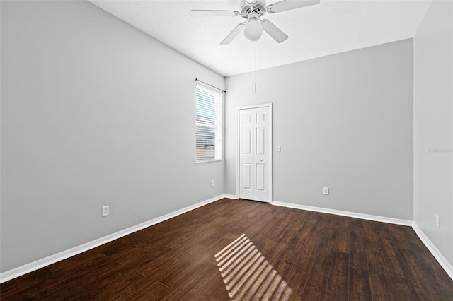 empty room with hardwood / wood-style floors and ceiling fan