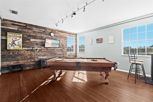 playroom featuring wood walls, hardwood / wood-style floors, a healthy amount of sunlight, and pool table