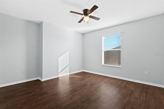 empty room with hardwood / wood-style floors, ceiling fan, and a textured ceiling