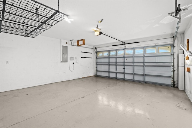 garage featuring electric panel and a garage door opener