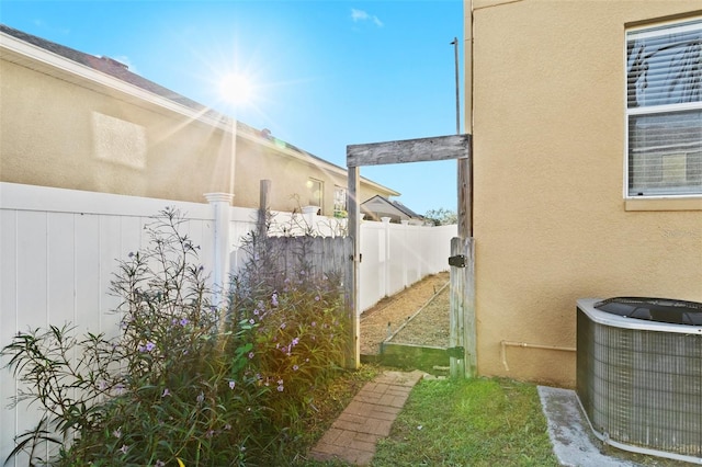 view of property exterior with central AC unit