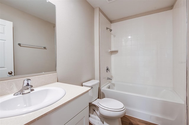 full bathroom featuring shower / tub combination, hardwood / wood-style flooring, vanity, and toilet