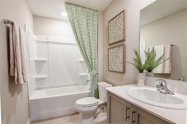 full bathroom with shower / bath combo, toilet, and vanity