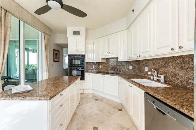 kitchen featuring dishwasher, dark stone counters, sink, black double oven, and white cabinetry