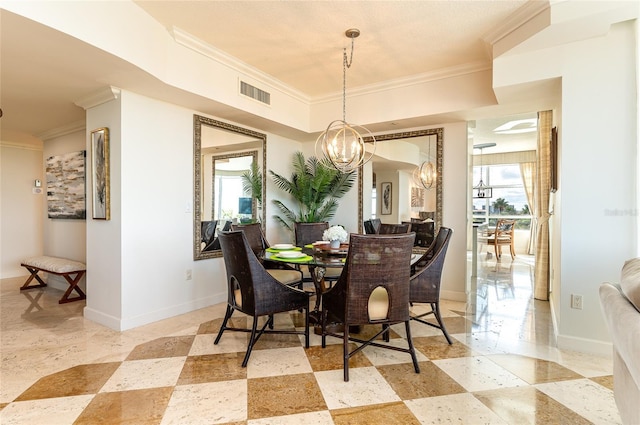 dining space featuring ornamental molding and a chandelier