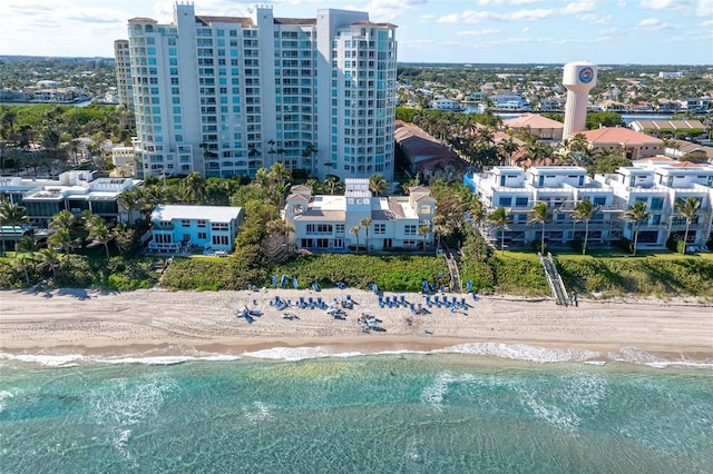 aerial view featuring a view of the beach and a water view