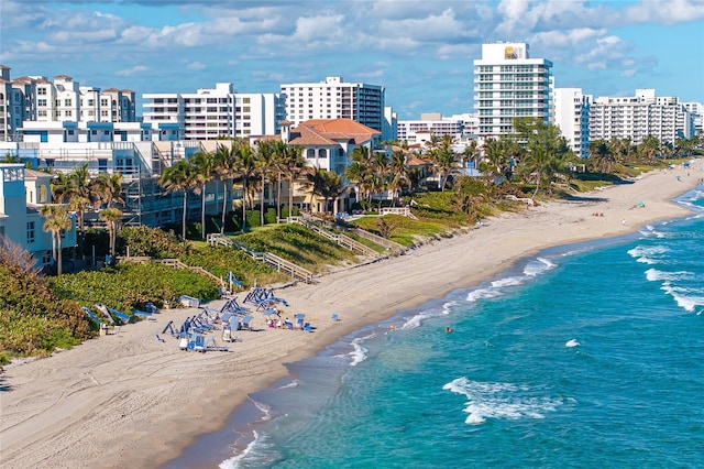 bird's eye view featuring a view of the beach and a water view