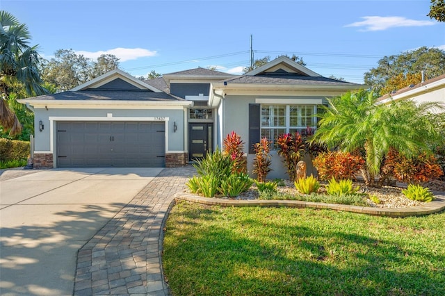 view of front of house with a garage and a front yard