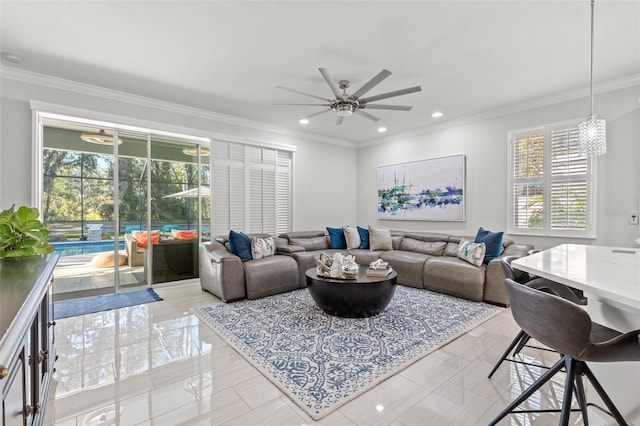 living room with ceiling fan and crown molding