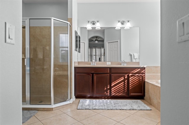 bathroom featuring tile patterned flooring, vanity, ceiling fan, and independent shower and bath