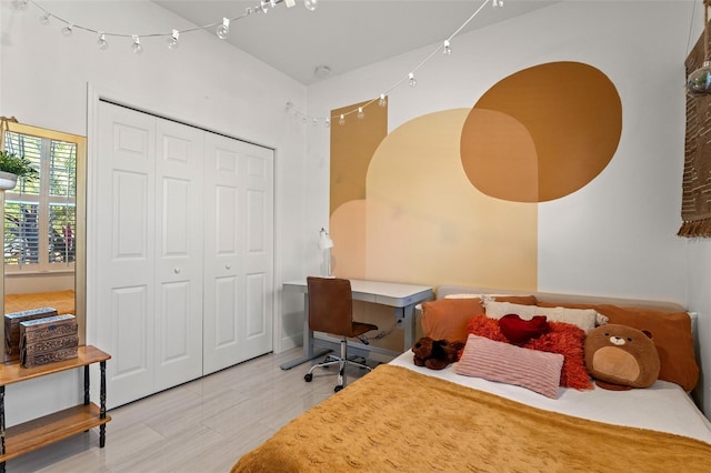 bedroom featuring hardwood / wood-style flooring and a closet