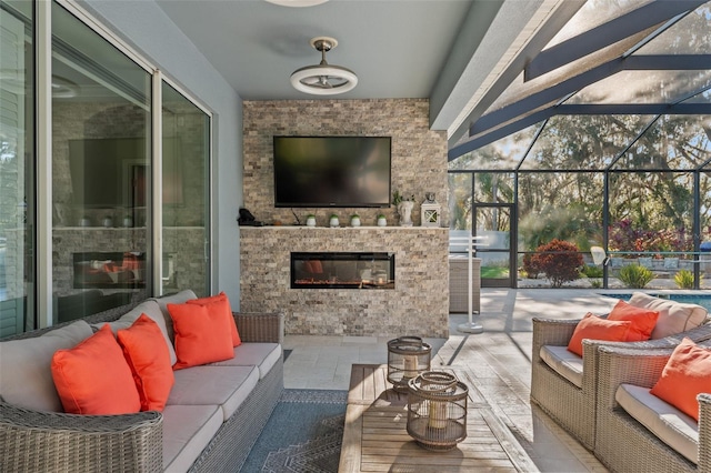 sunroom featuring a fireplace