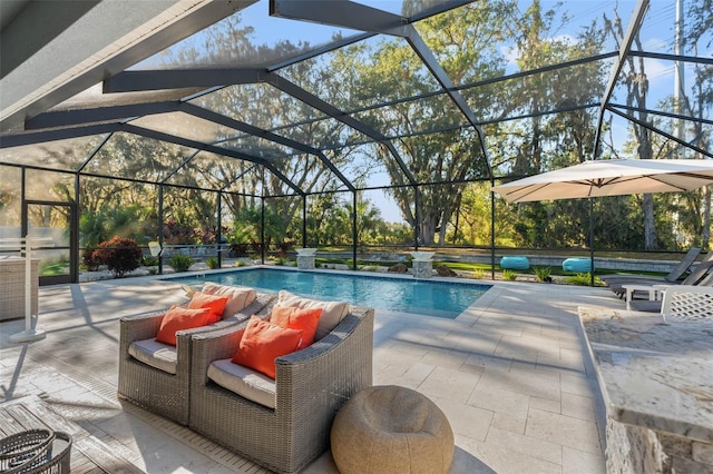 view of swimming pool with a lanai, pool water feature, and a patio