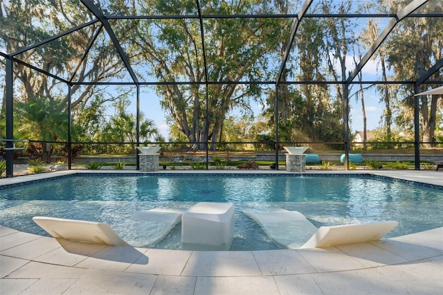 view of pool featuring glass enclosure