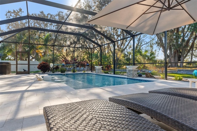 view of pool with a lanai and a patio area