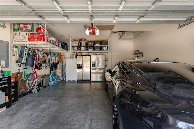 garage with stainless steel fridge, white fridge, and a garage door opener