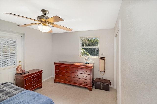 carpeted bedroom with ceiling fan