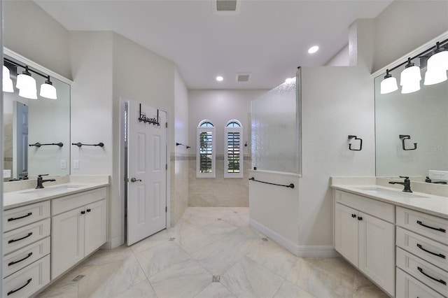 bathroom featuring vanity and walk in shower