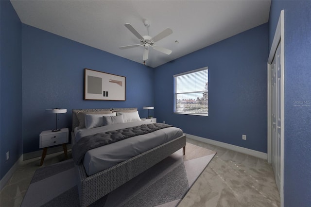 bedroom with ceiling fan, a closet, and light carpet