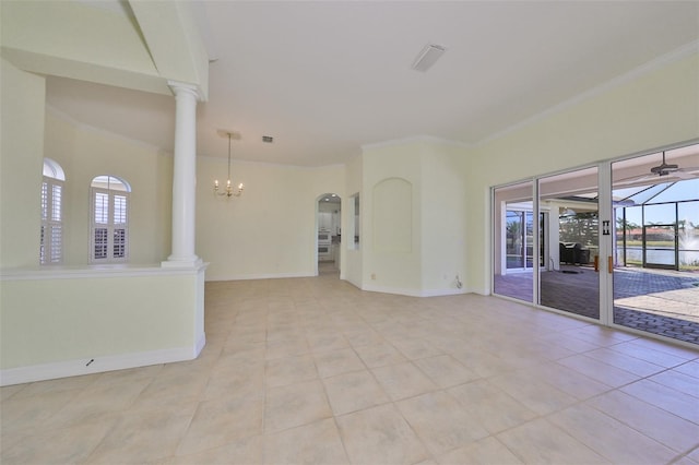 unfurnished room with a notable chandelier, light tile patterned flooring, and ornamental molding