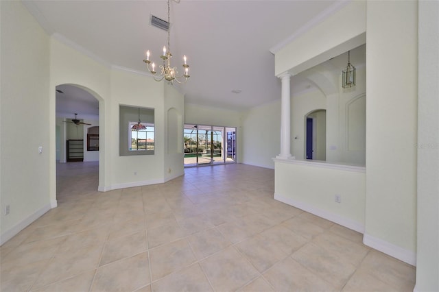 tiled empty room featuring ceiling fan with notable chandelier, ornamental molding, and ornate columns