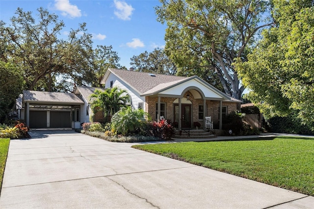 single story home with a garage and a front lawn