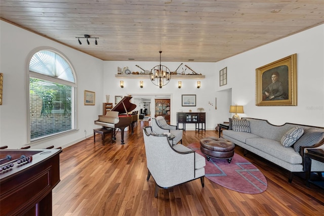 living room with hardwood / wood-style floors, an inviting chandelier, and wooden ceiling