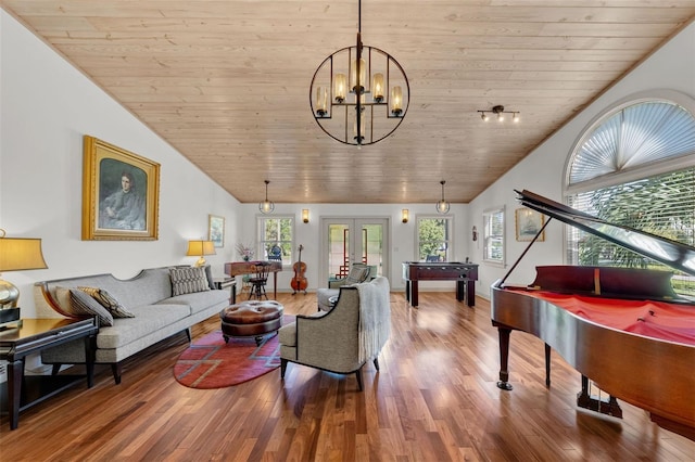 living room with a wealth of natural light, wooden ceiling, vaulted ceiling, and hardwood / wood-style flooring