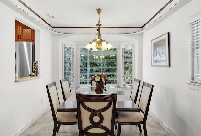 dining area featuring an inviting chandelier