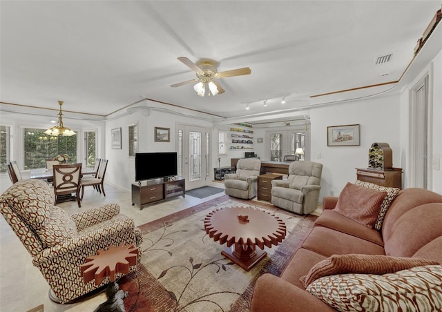 living room featuring ceiling fan, crown molding, and french doors