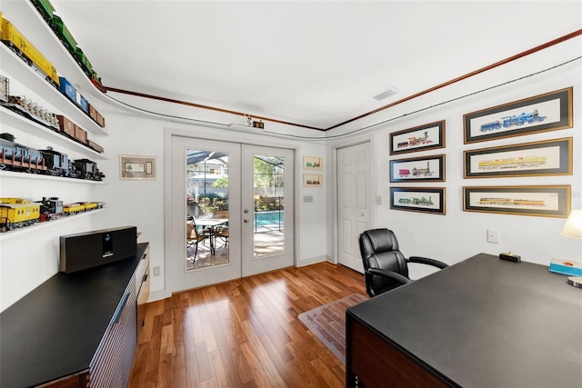 office featuring hardwood / wood-style floors and french doors