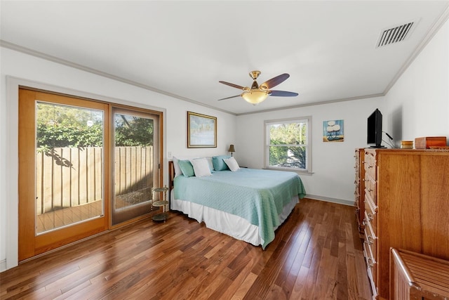 bedroom with ceiling fan, dark hardwood / wood-style floors, and crown molding