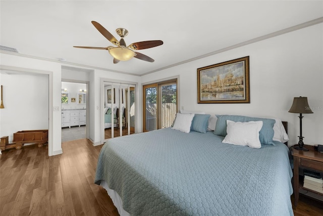 bedroom with ceiling fan, wood-type flooring, crown molding, and ensuite bath