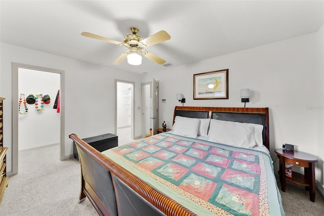 bedroom featuring ceiling fan and light carpet