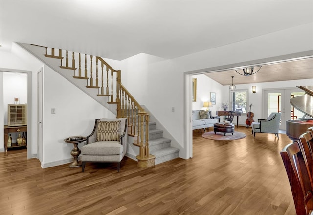 stairs featuring wood-type flooring