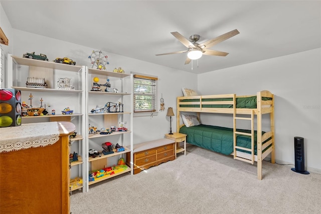 bedroom featuring light colored carpet and ceiling fan