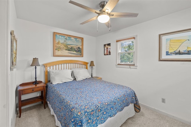 bedroom featuring ceiling fan and carpet