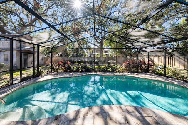 view of pool with a lanai