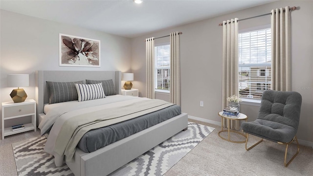 carpeted bedroom with multiple windows