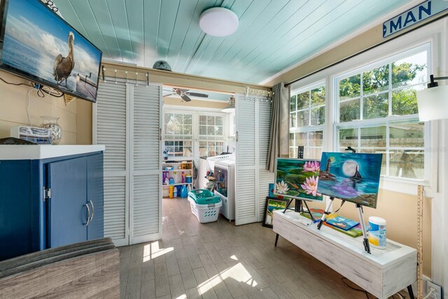 interior space featuring wood ceiling, a wealth of natural light, and ceiling fan