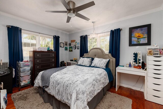 bedroom with multiple windows, ceiling fan, and dark hardwood / wood-style floors