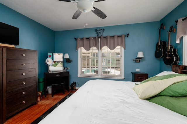 bedroom featuring dark hardwood / wood-style floors and ceiling fan