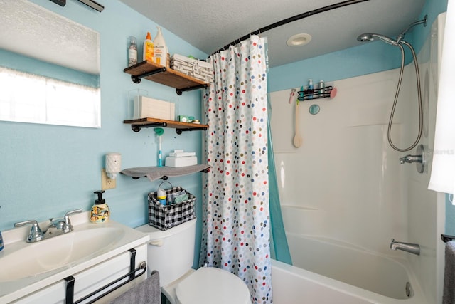 full bathroom with vanity, shower / tub combo, a textured ceiling, and toilet