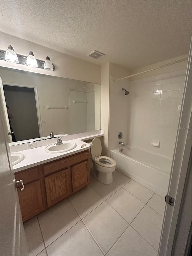 full bathroom featuring vanity, bathing tub / shower combination, tile patterned flooring, toilet, and a textured ceiling